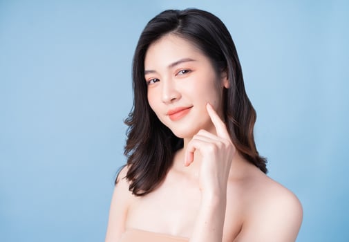 Attractive young Asian woman with fresh skin. Face care, facial treatment, , woman beauty skin isolated on white background. cosmetology, beauty skin and cosmetic concept photo