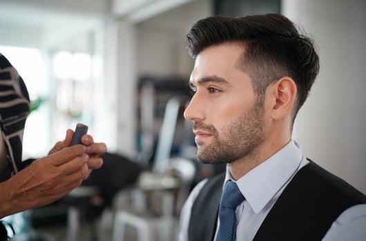 portrait of handsome man was make up by artist on his face. photo