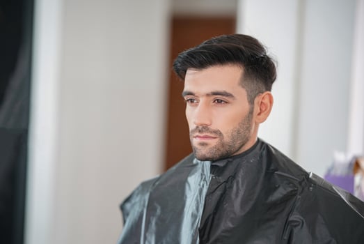 portrait of handsome man was make up by artist on his face. photo