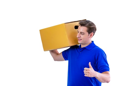 Happy young courier on blue T shirt uniform with parcel and clipboard on white background photo