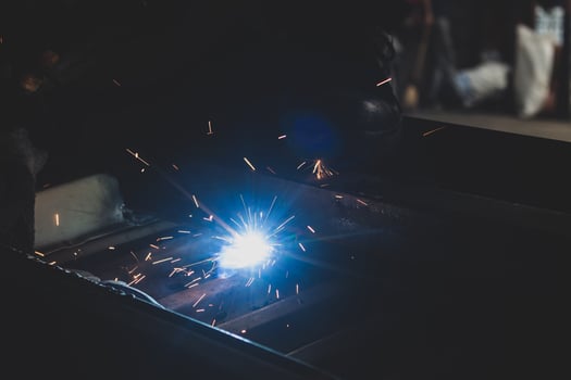 welder, welding automotive part in a car factory photo