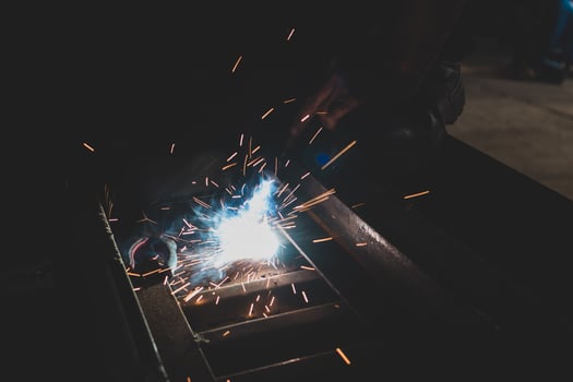 welder, welding automotive part in a car factory photo