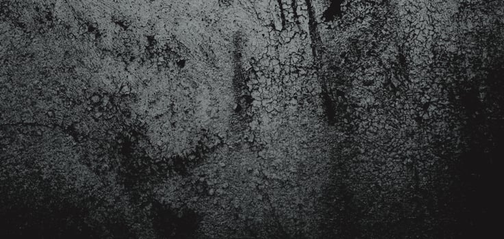 Wall full of scratches. Grungy cement texture for background, Scary dark wall.Black wall photo