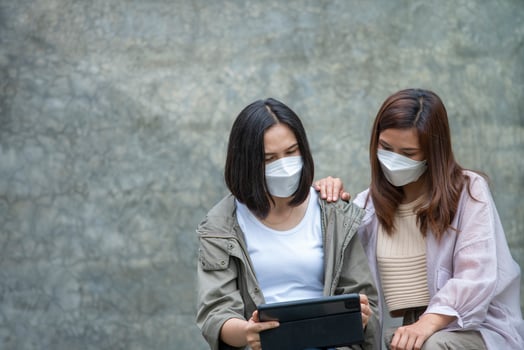 Asian Woman and Fellow Investor with Cryptocurrencies via Blockchain photo