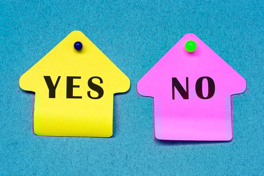 Yes and No yellow and pink note on a blue board. Yes or No decision making photo