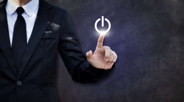 Businessman pressing power button. Concept of technology, internet and business. photo