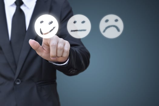 Businessman pressing smiley face icon on virtual screen. Concept of satisfaction evaluation and feedback. photo