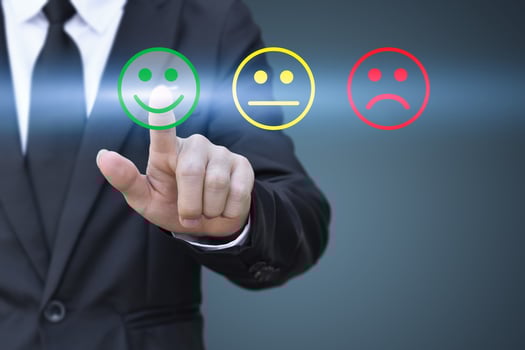 Businessman pressing smiley face icon on virtual screen. Concept of satisfaction evaluation and feedback. photo