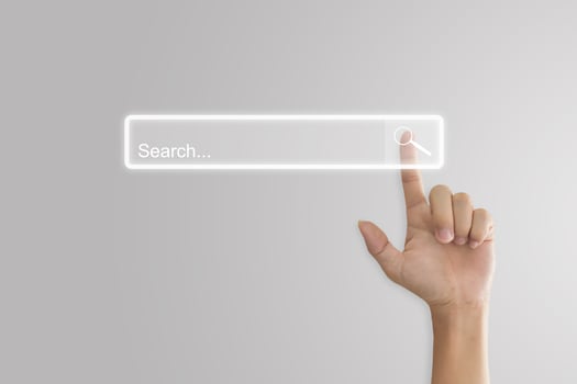 Hand click search button page on virtual screen. Idea for searching browse data information networking. Copy space for text. photo