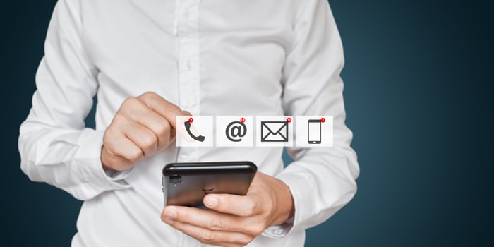CONTACT US, Businessman hand holding mobile phone with address, phone, email icon. Concept of customer service call center. photo