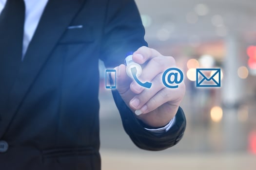 CONTACT US. Businessman hand drawing icon phone, mail, address. photo