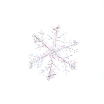 Snowflake isolated on white background.Toy snowflake as Christmas tree decoration. photo