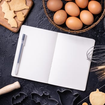 Making cookies cookbook recipe design concept, baking ingredients preparation layout with notebook, top view, flat lay, overhead, mockup copy space. photo