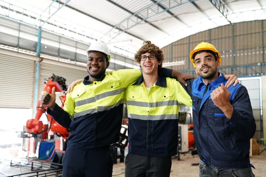 Industrial engineer or worker wearing a helmet while standing in a heavy industrial factory. The Maintenance looking of working at industrial machinery and check security system setup in factory. photo