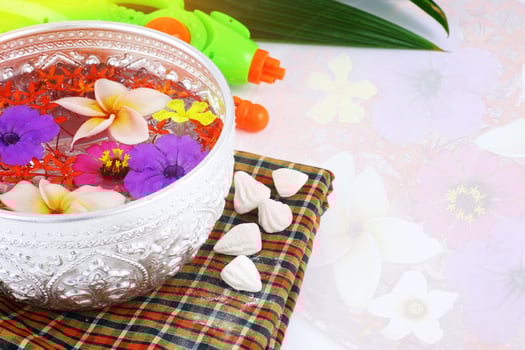 Thai traditional famous festival - Songkran day - bowl of water and beautiful flower photo