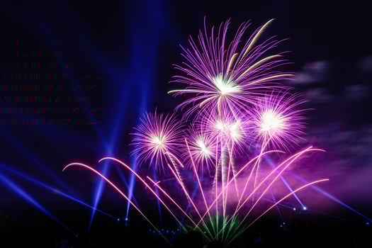 Colored firework background with free space for text. Colorful fireworks at night light up the sky with dazzling display. photo