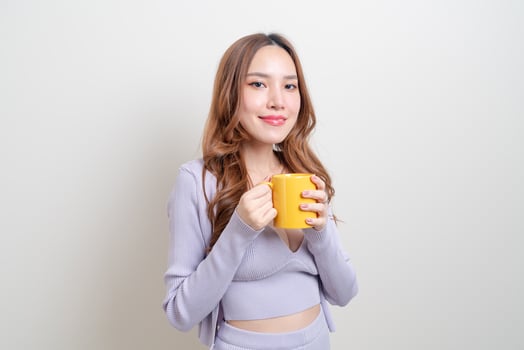 portrait beautiful Asian woman holding coffee cup or mug photo