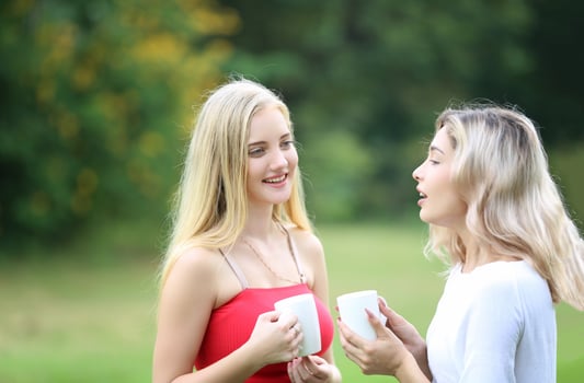 Portrait of two young friends outdoors. photo