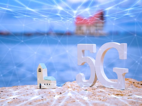 Symbol of white 5G with wifi and transmission network on stone seaside with blue sky. Network internet, communication wireless and 5G standard of signal social concept. photo