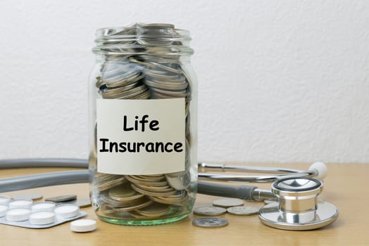 Money saving for life Insurance in the glass bottle photo