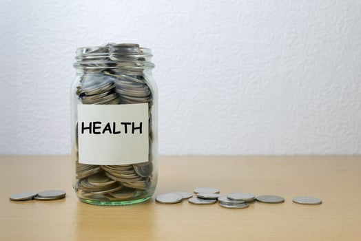 Money saving for health in the glass bottle photo