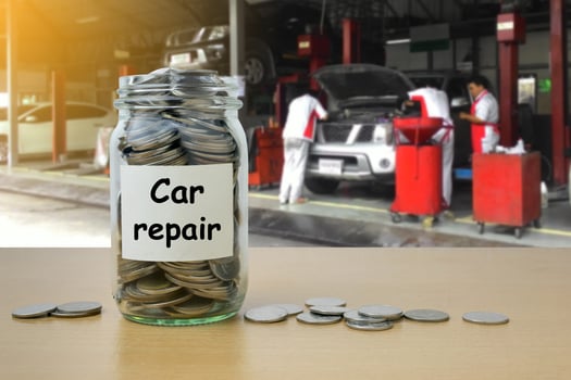 Money saving for Car repair in the glass bottle photo