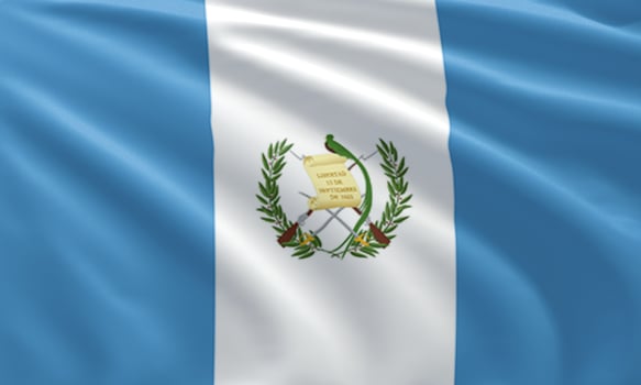 close up waving flag of Guatemala photo