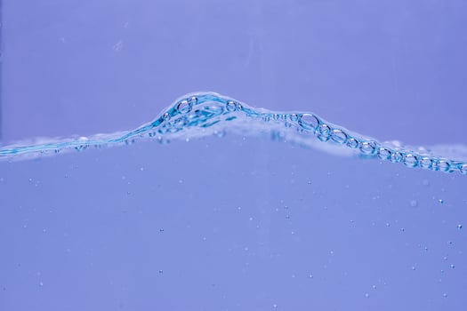 Water and air bubbles over white background with space for text photo