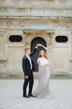Two lovers walk along Krakow photo