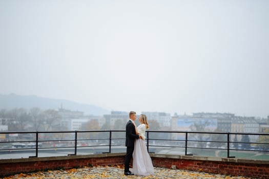 Two lovers walk along Krakow photo