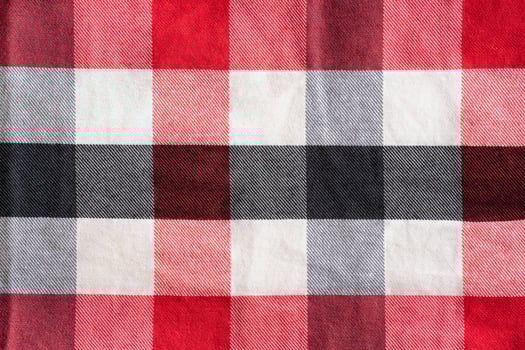 Red black and white checker pattern textile photo