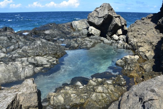 Turquoise Natural Pool Along the Coast of Aruba photo