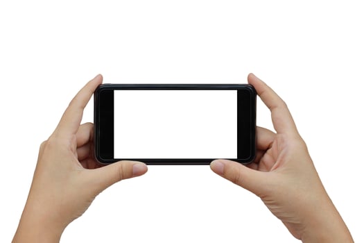 Hand holding smartphone with white blank screen on white background. photo