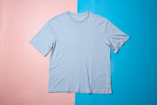 Blue t-shirt mockup on colorful background. Flat lay tee template photo