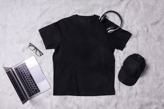 Black t-shirt mockup with man accessories on grey background. Flat lay tee template photo
