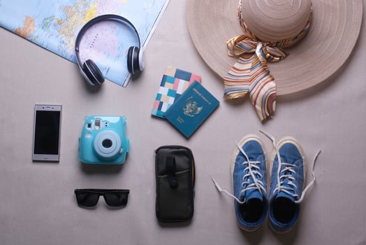 Creative flat lay composition of various traveler or holiday accessories for travel concept background photo
