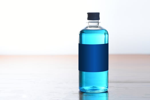 Blue alcohol bottle to wash wounds photo