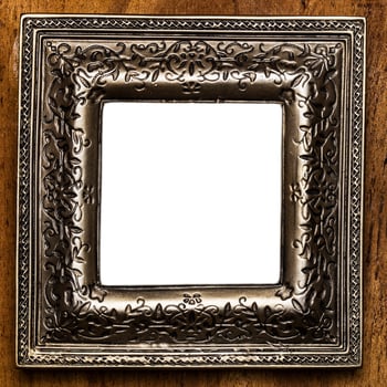 Vintage photo frame over wooden background