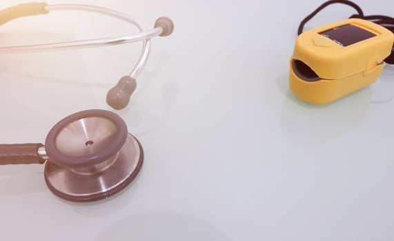 Medical stethoscope and oximeter or blood oxygen meter photo