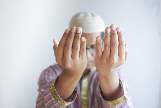 muslim man keep hand in praying gestures during ramadan, Close up photo