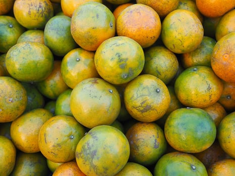 Pile of tangerines for sale in the market photo