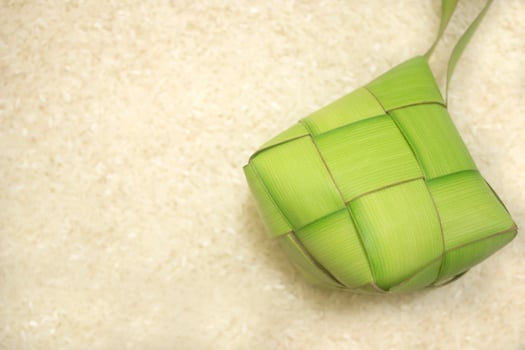 Ketupat or rice dumpling on ketupat another a background photo