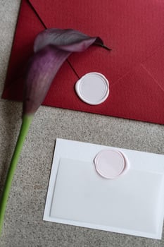 wedding invitation in a gray envelope on a table photo