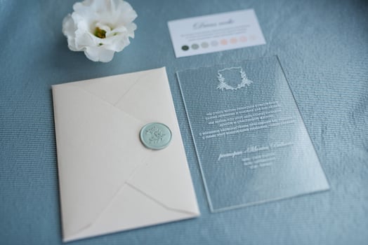 wedding invitation in a gray envelope on a table photo