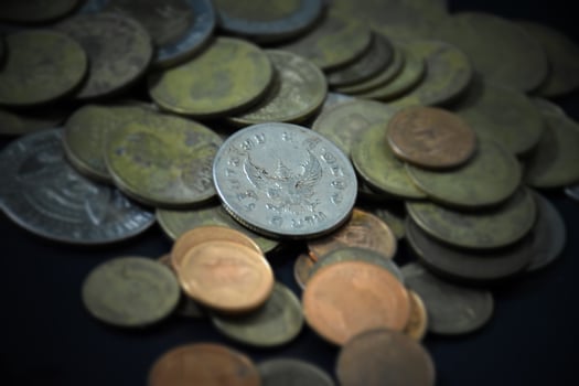 Thai bahts coins on dark background, photo