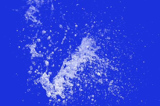 Water Splash on blue background. photo