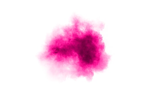 Abstract pink powder explosion on white background. Freeze motion of pink dust splattered. photo