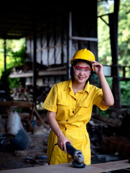 A woman in a uniform working in a technician is preparing to use the tools photo