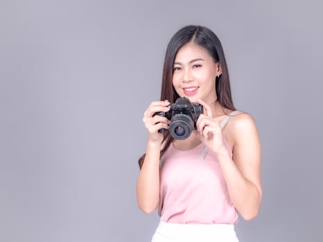 Beautiful and charming women dressed in casual style, carrying film cameras photo
