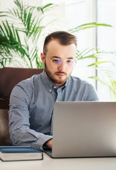 Businessman working on his laptop in an office photo